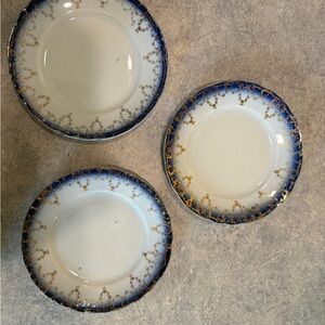 Vintage French Saxon China dessert plates with a cobalt blue rim